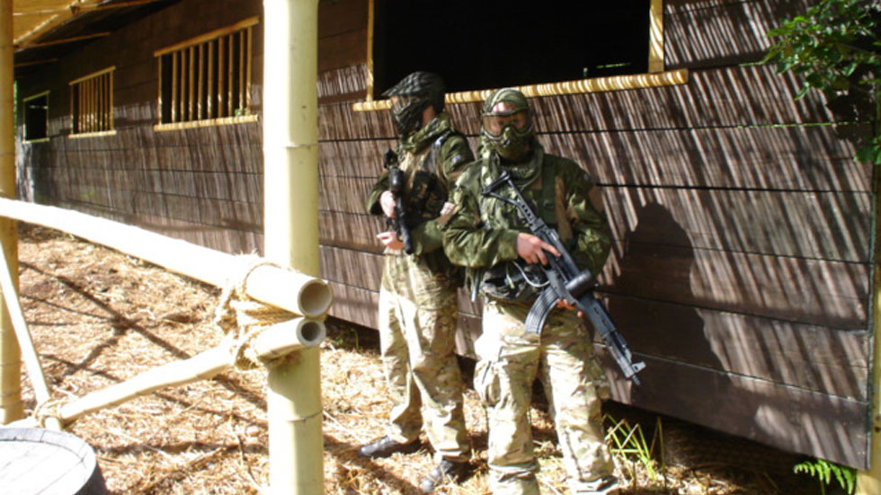 paintball players outside hanoi hilton base